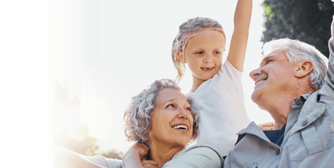 An older couple and a little girl are having a good time.