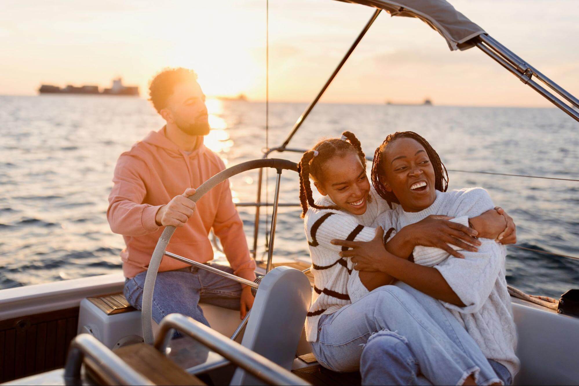 Family on a sailboat at sunset - family stock pictures and royalty-free images.